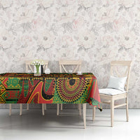 Colorful patterned tablecloth on dining table with geometric shapes in green, red, yellow