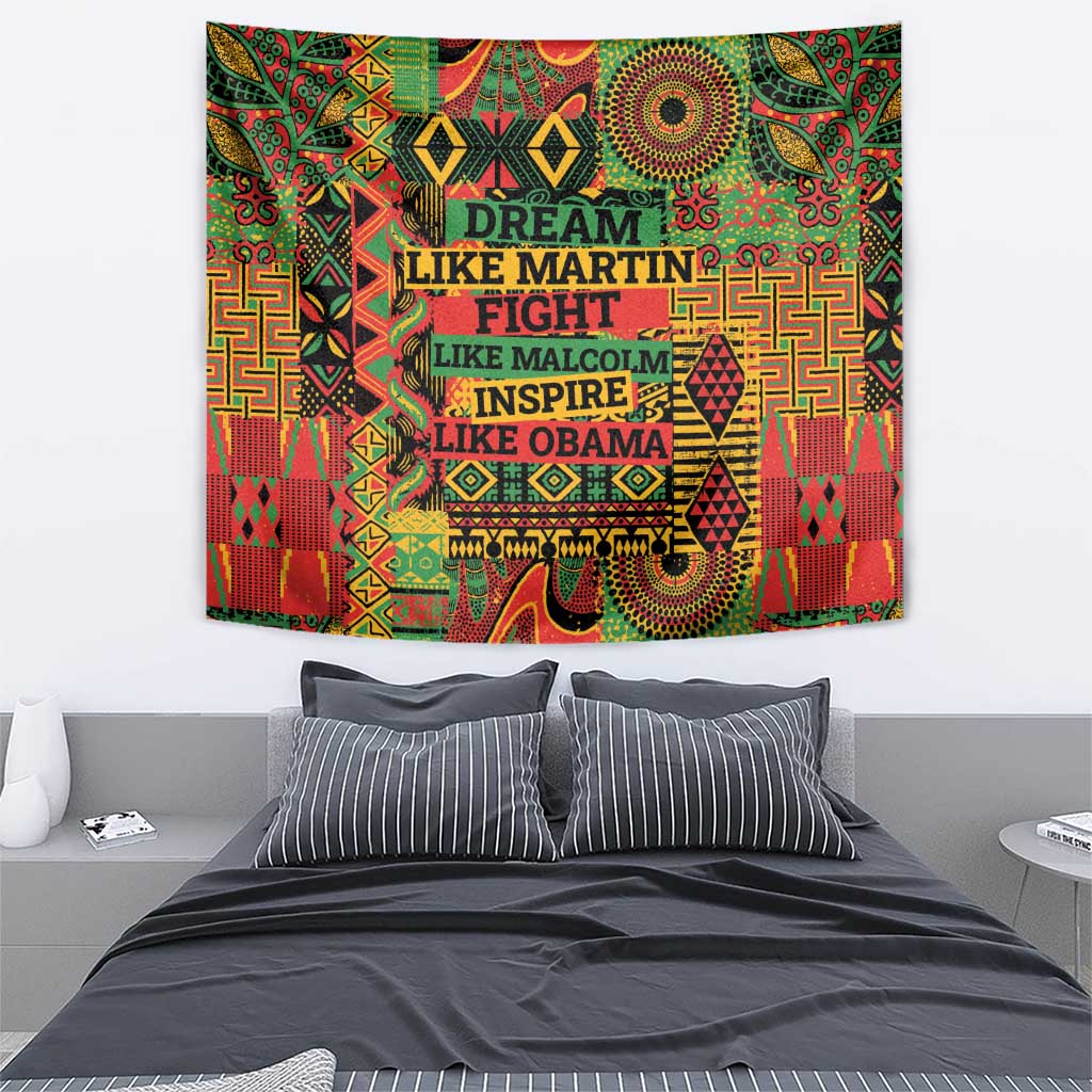 Colorful text-and-motif wall tapestry hung above a bed