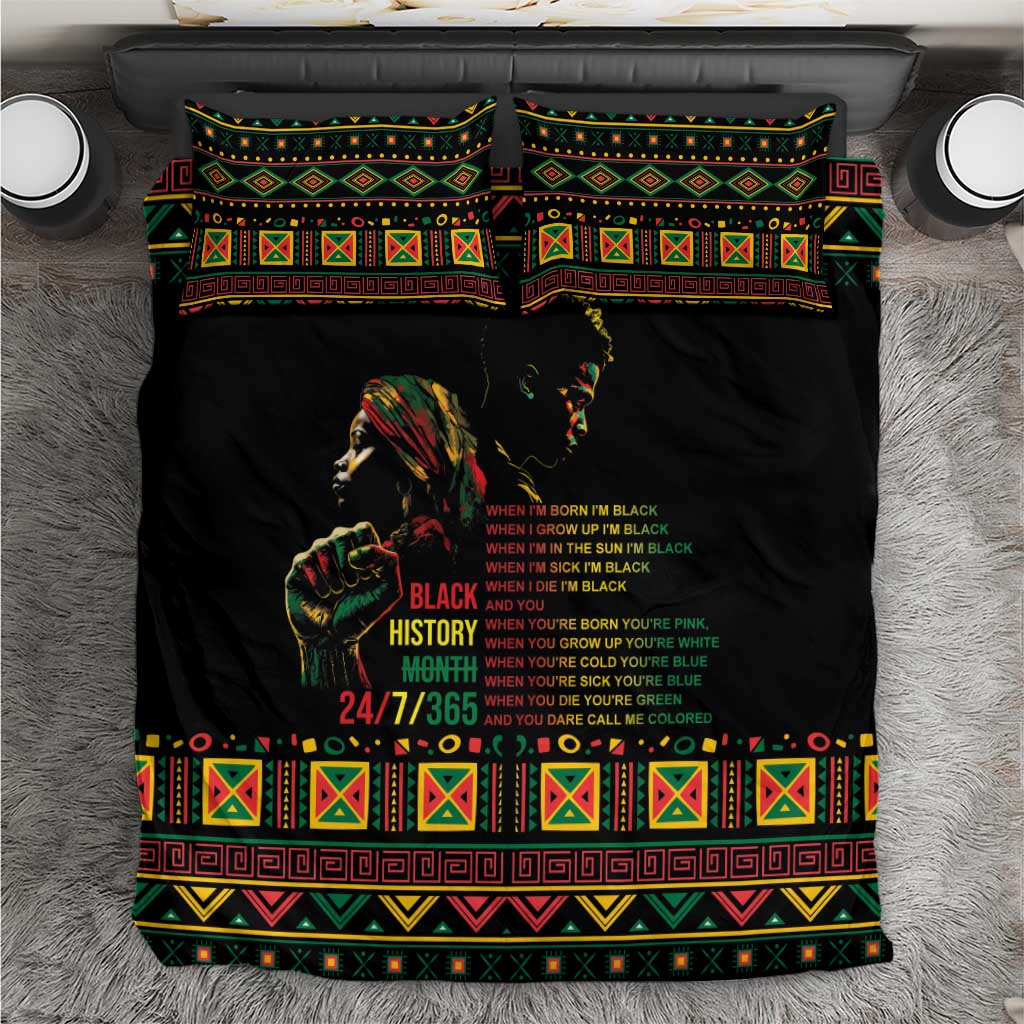 Black bedding set with colorful tribal border and portrait graphic on duvet