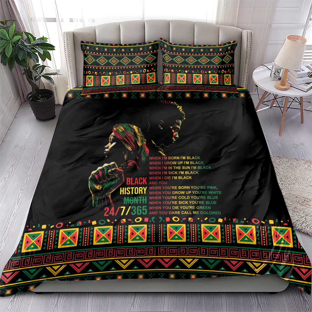 Black bedding set with two matching pillow shams and colorful patterned duvet border