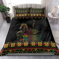 Black bedding set with two matching pillow shams and colorful patterned duvet border