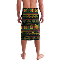 Black lavalava skirt with colorful geometric stripe pattern and rows of symbols