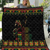 Black quilt with diamond stitching and colorful tribal-style border, graphic front panel