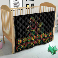 Black quilt with diamond stitching and colorful patterned border for baby bed
