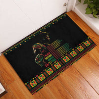 Black rubber doormat with colorful geometric border and portrait-style Black History text.