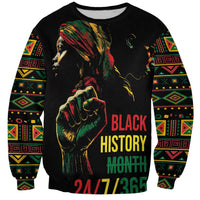 Black crewneck sweatshirt with colorful portrait, fist graphic, and “BLACK HISTORY MONTH”