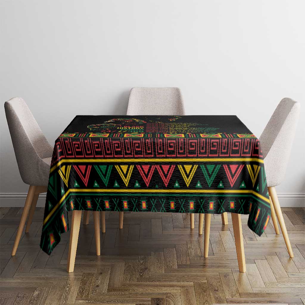 Black tablecloth covering dining table with colorful patterned border