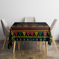 Black tablecloth covering dining table with colorful patterned border