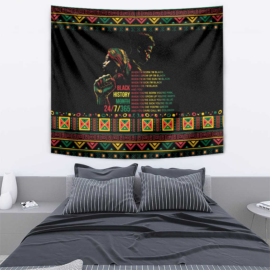 Black tapestry featuring Black History Month text, portrait silhouette, and decorative border