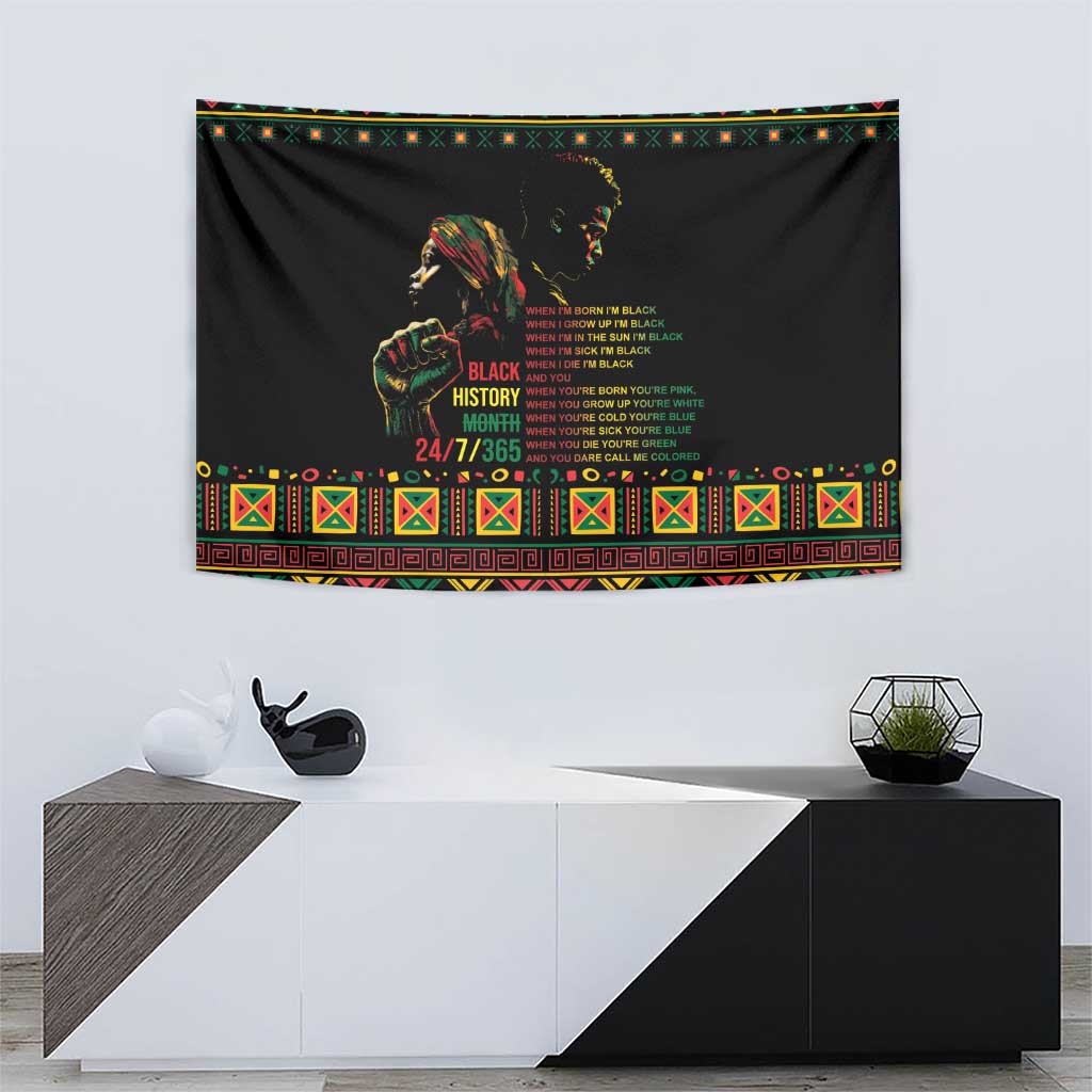 Black wall tapestry with portrait and Black History Month message, colorful patterned frame