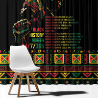 Black window curtain panel with large Black History Month style text and border trim
