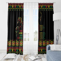 Black grommet-top window curtain panels with multicolor border and portrait quote print