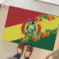 Rubber doormat on patio with Bolivia condor emblem and kantuta flowers, red yellow green