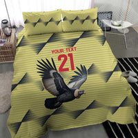 Yellow duvet with condor graphic and 21, two pillowcases