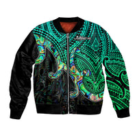 Green bomber jacket with black sleeves, ribbed collar and zip front, tribal shell pattern