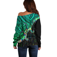 Off-shoulder sweater back view, green tribal print with large shell graphic
