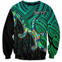 Unisex crewneck sweatshirt with green tribal pattern and colorful shell-style graphic