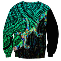 Unisex crewneck sweatshirt with green tribal background and large iridescent shell graphic