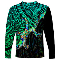 Unisex long sleeve shirt with green tribal print and colorful koru motif on front