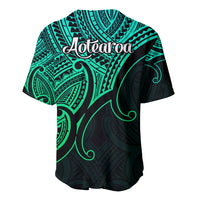 Green and black baseball jersey with Aotearoa script and Maori koru-inspired design