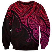 Unisex pink-and-black sweatshirt with large koru-style graphic and tribal pattern