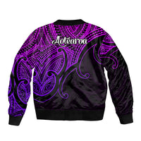 Purple and black bomber jacket with Aotearoa graphic on back and tribal pattern sleeves