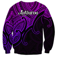 Unisex purple sweatshirt with back Aotearoa text and Maori-inspired koru pattern