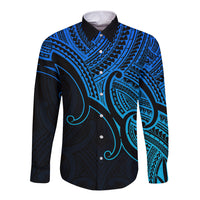 Long-sleeve button-up shirt in blue with dark Maori koru-style tribal pattern