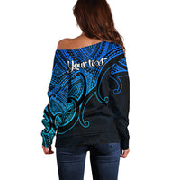 Women’s off-shoulder sweater back with blue/black Polynesian print and “Your text”