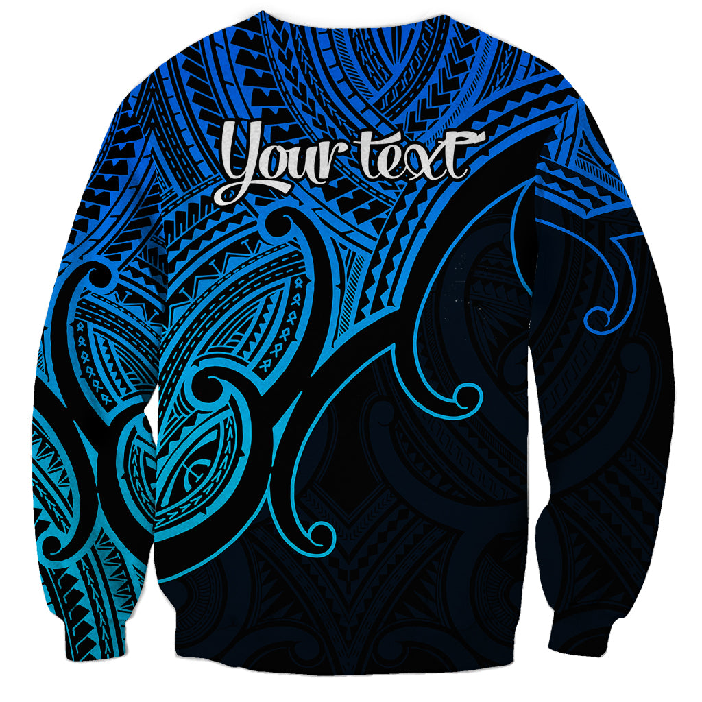 Blue crewneck sweatshirt back with 'Your text' above tribal koru pattern