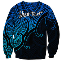 Blue crewneck sweatshirt back with 'Your text' above tribal koru pattern