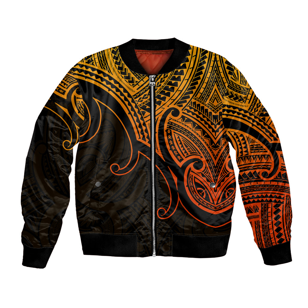 Gold and black bomber jacket with zip front, ribbed cuffs, Polynesian koru and tribal patterns