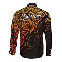 Gold and black long-sleeve button shirt with Polynesian tribal print and chest text area