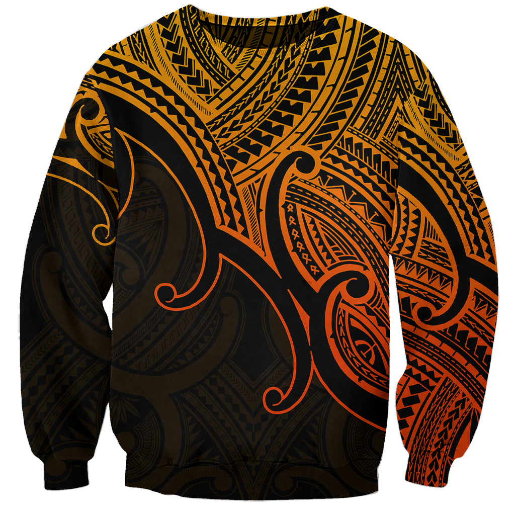 Unisex crewneck sweatshirt in gold with black and orange Polynesian tribal print front