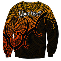 Unisex crewneck sweatshirt in gold with cursive slogan and Polynesian tribal print back