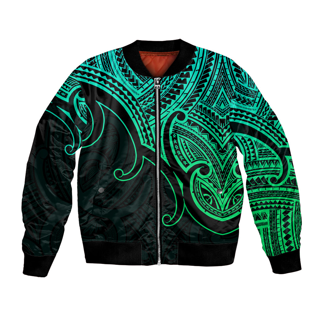 Green and black unisex bomber jacket with ribbed cuffs, zip front, and teal tribal koru print
