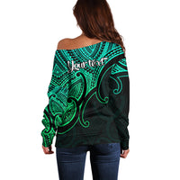 Women’s off-shoulder sweater, back shows 'Your text' over turquoise Polynesian print