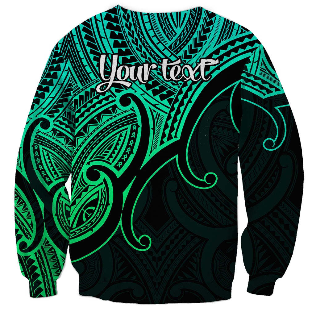 Unisex green crewneck sweatshirt with black Polynesian bird and koru swirl print