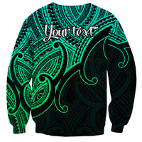 Unisex green crewneck sweatshirt with black Polynesian bird and koru swirl print