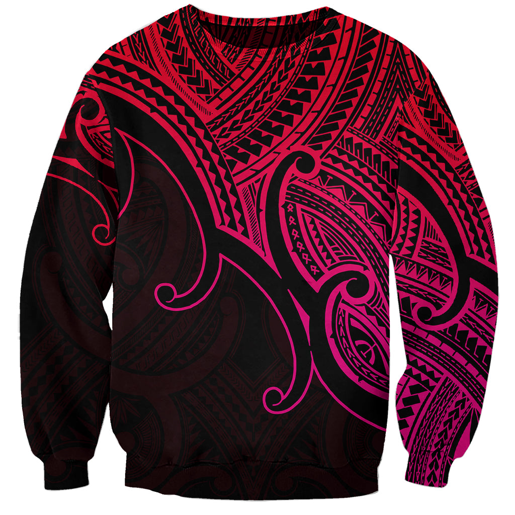 Unisex crewneck sweatshirt in pink and black with Polynesian-style koru pattern