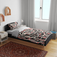 Bedding set with black, white, and red tribal pattern duvet and matching pillows
