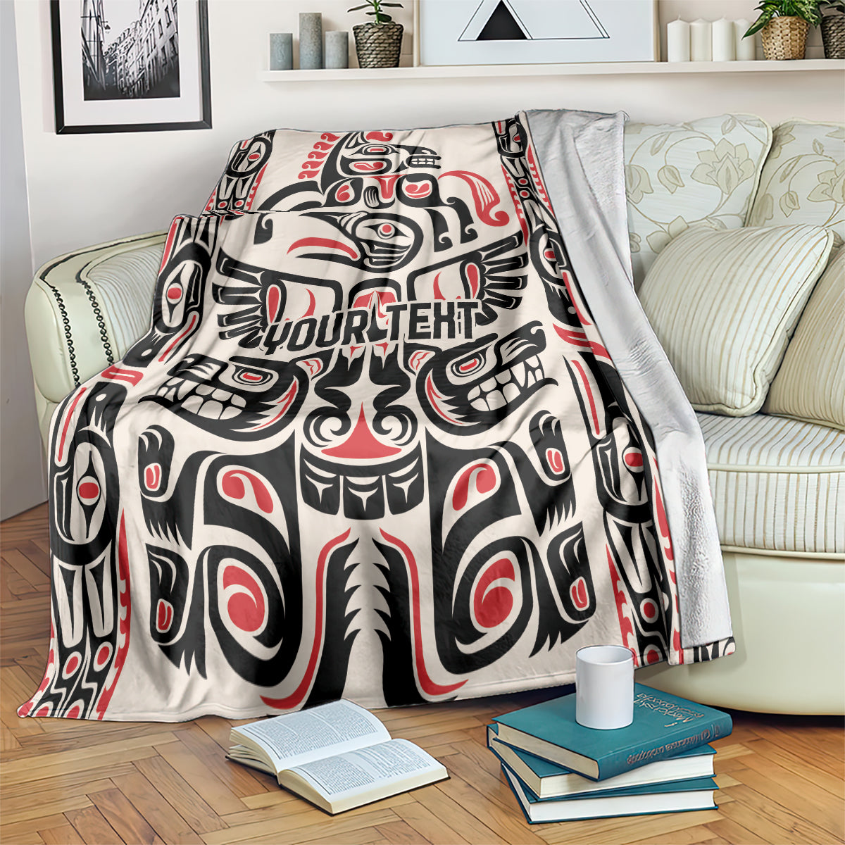 Haida-style throw blanket with red/black/white pattern and 'YOUR TEXT' print