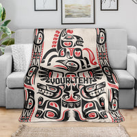 Haida-style throw blanket on gray sofa, red/black/white design with 'YOUR TEXT'