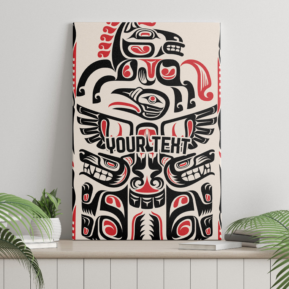 Wood-framed canvas wall art with large black-and-white totem and red accents, centered.