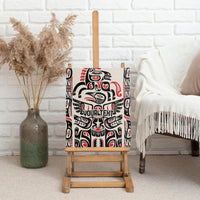 Wood-framed canvas wall art with black, white, and red Haida-style totem design.