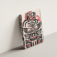 Wood-framed canvas wall art angled on wall, black, white, and red Haida-style print.