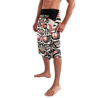 Side view knee-length swim shorts with black waistband and Haida-style red and white print