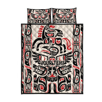 Bed quilt set with two pillow shams and black, white, red tribal totem artwork, flat lay