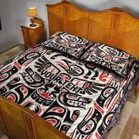 Quilt bed set with bold black, white, and red tribal artwork and matching pillow shams