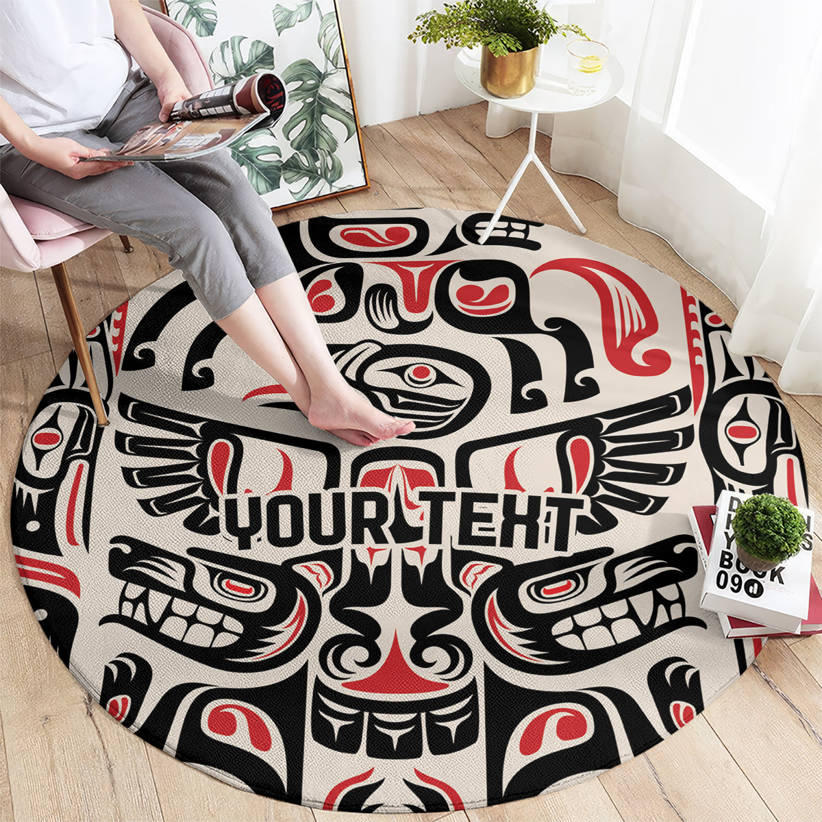 Round carpet with black, cream, and red totem pattern and 'YOURTEHT' lettering